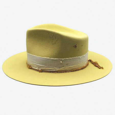 A lemon felt fedora hat with linen trimmings and gold details by Valeria Andino