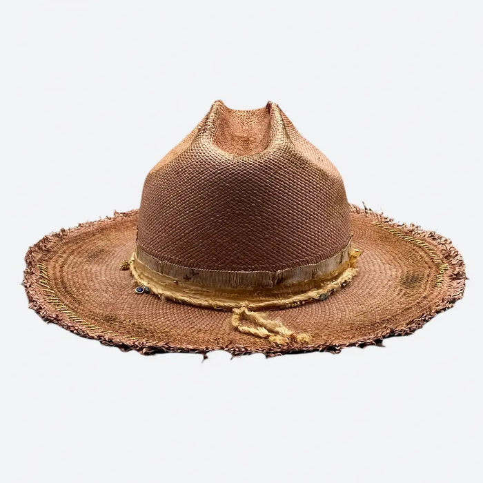 Rear view of a Valeria Andino Handmade Cattleman Straw Hat In a bronze colour with ruffled brim, course gold stitching and gold detailing
