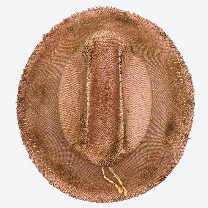 Top view of a Valeria Andino Handmade Cattleman Straw Hat In a bronze colour with ruffled brim, course gold stitching and gold detailing