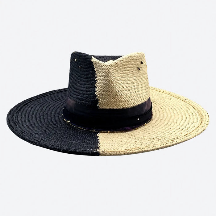 Front view of a Valeria Andino split colour fedora straw hat with hand dyed silk trimmings, gold chain, dark studs with stitch details