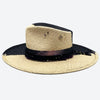 Side view of a Valeria Andino split colour fedora straw hat with hand dyed silk trimmings, gold chain, dark studs with stitch details