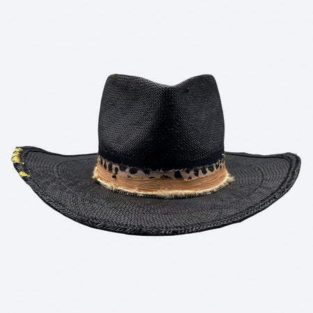 Front view of a Valeria Andino Handmade Straw Hat, its Classic cowboy shape in black with hand dyed silk trimmings and gold stitching